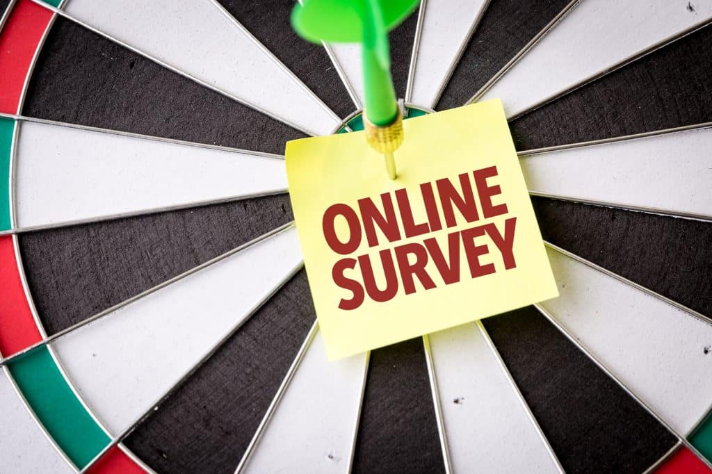 online survey note on a dart board