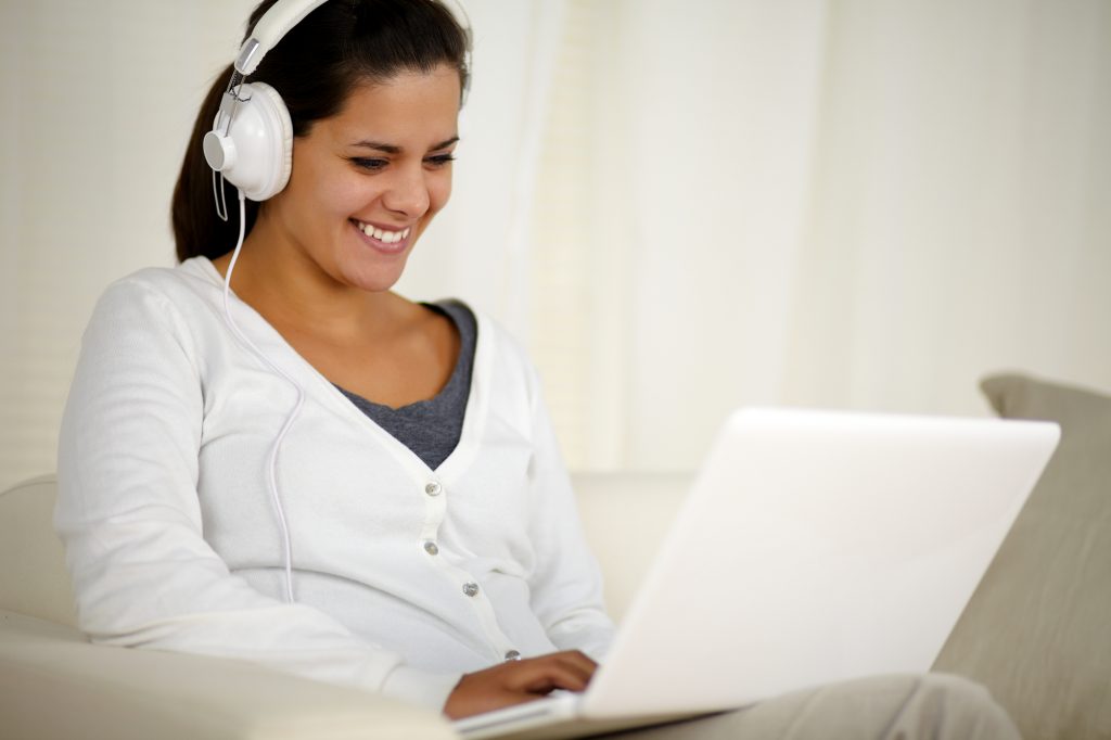 girl doing transcription on her laptop