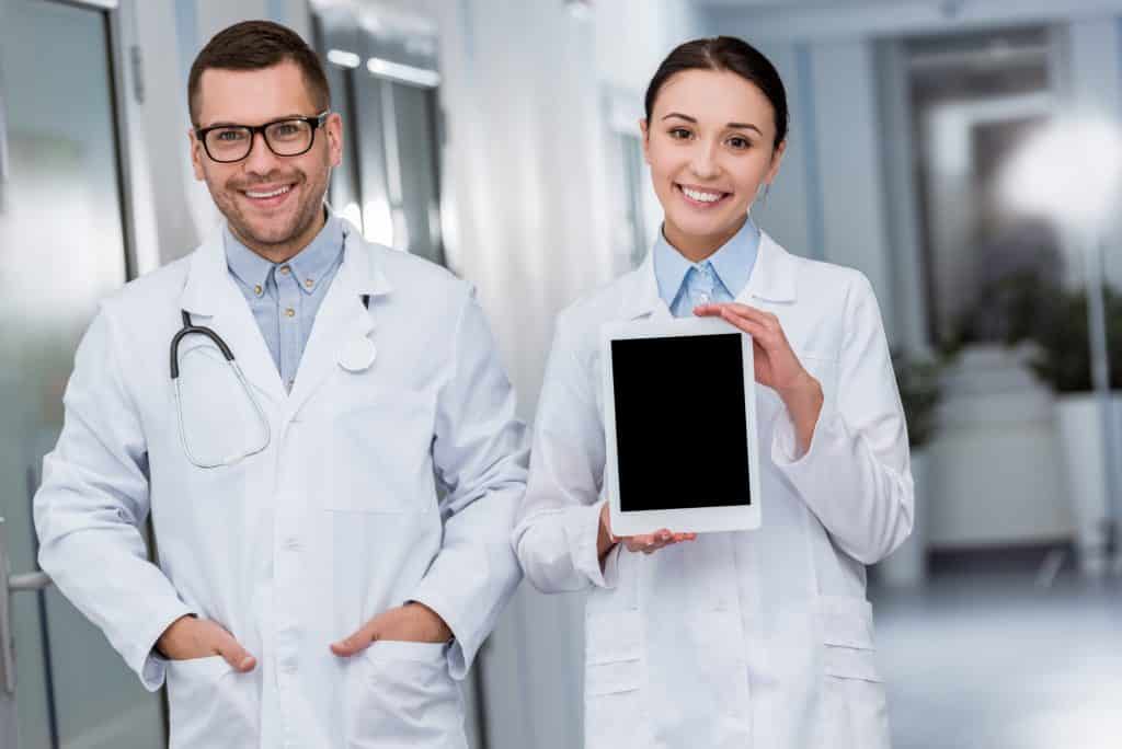 doctors holding a tablet for doing online surveys