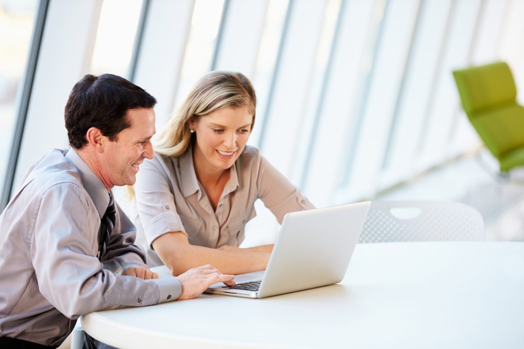 man and woman doing get paid to tasks on laptop