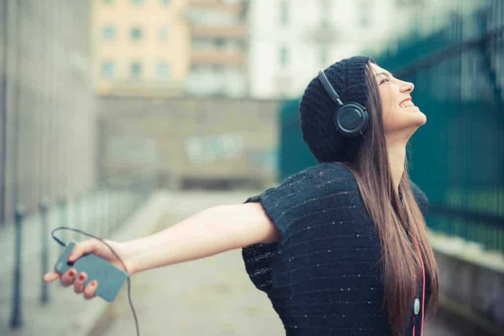 girl listening to music online and earning money